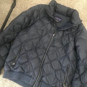 Large fitted navy blue Patagonia puffer jacket